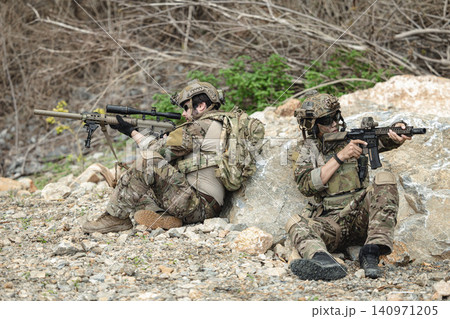 Military rangers, US Marine engaged in jungle combat operation deep in tropical forest 140971205