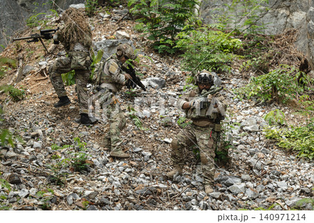 Military rangers, US Marine engaged in jungle combat operation deep in tropical forest Military rangers, US Marine engaged in jungle combat operation deep in tropical forest 140971214