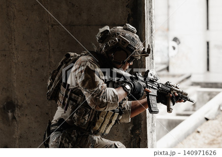 Special forces soldier aiming rifle, military tactical operation portrait Special forces soldier aiming rifle, military tactical operation portrait 140971626