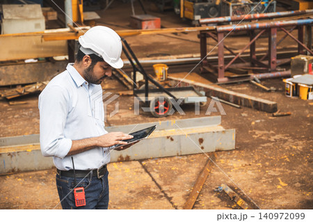 Asian Indian construction Engineer male, Builder lead construction site working control operate site. Asian Indian construction Engineer male, Builder lead construction site working control operate site. 140972099