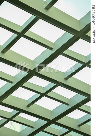 The low angle view of the building ceiling. Interior of modern architecture, modern city building. Interior design. Details of modern architecture. Building abstract. Building background. The low angle view of the building ceiling. Interior of modern architecture, modern city building. Interior design. Details of modern architecture. Building abstract. Building background. 140973593
