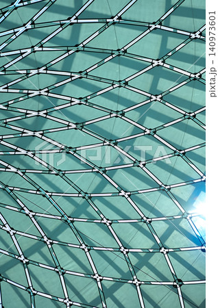 The low angle view of the building ceiling. Interior of modern architecture, modern city building. Interior design. Details of modern architecture. Building abstract. Building background. The low angle view of the building ceiling. Interior of modern architecture, modern city building. Interior design. Details of modern architecture. Building abstract. Building background. 140973601