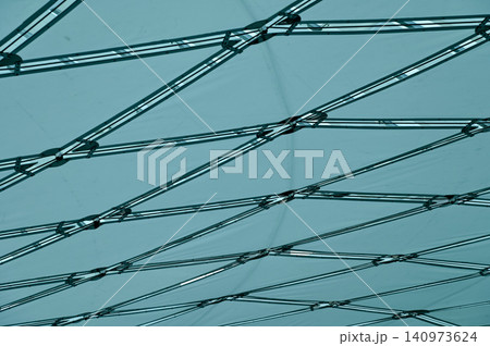 The low angle view of the building ceiling. Interior of modern architecture, modern city building. Interior design. Details of modern architecture. Building abstract. Building background. The low angle view of the building ceiling. Interior of modern architecture, modern city building. Interior design. Details of modern architecture. Building abstract. Building background. 140973624