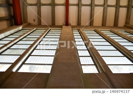 The low angle view of the building window. Modern architecture, modern city building. Interior design. Details of modern architecture. Building abstract. Building background. The low angle view of the building window. Modern architecture, modern city building. Interior design. Details of modern architecture. Building abstract. Building background. 140974137