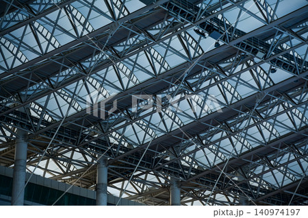 Close-up of the stadium ceiling. Modern architecture, modern city building. Exterior design. Details of modern architecture. Building abstract. Building background. Close-up of the stadium ceiling. Modern architecture, modern city building. Exterior design. Details of modern architecture. Building abstract. Building background. 140974197