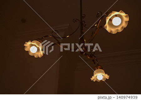 Close-up of the lighting indoors. Light bulb. Interior design, decoration. Lighting equipment. 140974939