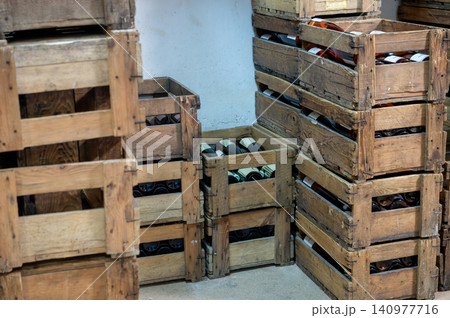 Stacked Wine Crates in Cellar Vintage Bottles Warm Light Stacked Wine Crates in Cellar Vintage Bottles Warm Light 140977716
