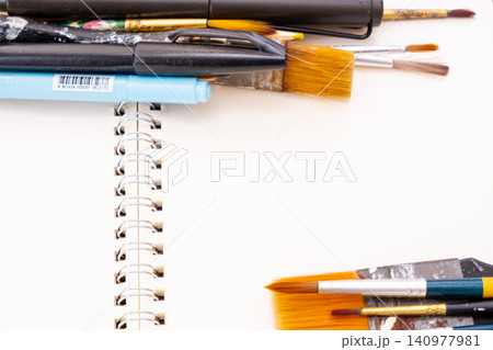 painting brush art supplies artistic tools on art book white paper background 140977981