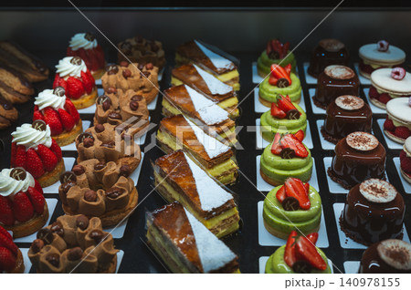 Assorted French Pastries in Display Case Tarts and Eclairs Assorted French Pastries in Display Case Tarts and Eclairs 140978155