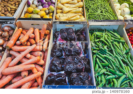 Colorful Fresh Vegetables at Market Stalls Wooden Crates Colorful Fresh Vegetables at Market Stalls Wooden Crates 140978160