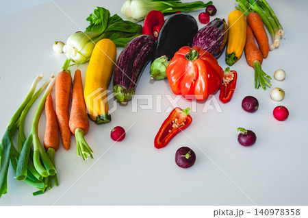 Scattered fresh vegetables on white surface 140978358