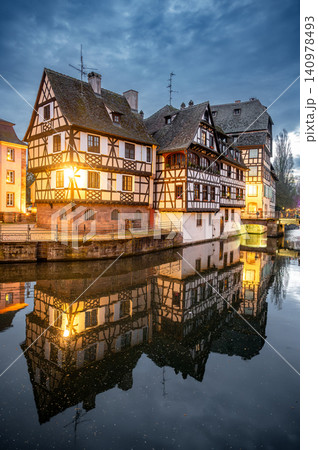 Evening Canal Warm Lights Reflecting on Calm Surface Evening Canal Warm Lights Reflecting on Calm Surface 140978493