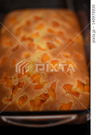 Fresh apricot loaf cake in baking pan Fresh apricot loaf cake in baking pan 140978930