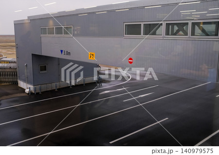 Close-up of the jet bridge in Nagoya airport, Japan. Transportation facility, airport scene. Travel concept. Close-up of the jet bridge in Nagoya airport, Japan. Transportation facility, airport scene. Travel concept. 140979575