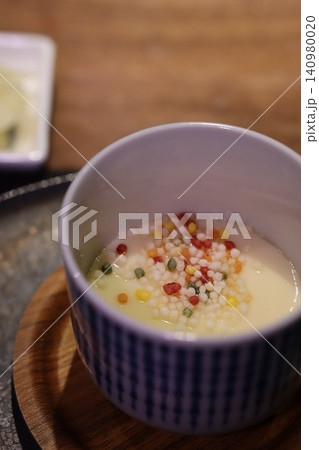 Bowl of Creamy Grains with Colorful Additions 140980020