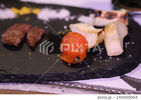 Grilled Meat and Roasted Tomato on Slate Plate Grilled Meat and Roasted Tomato on Slate Plate 140980064
