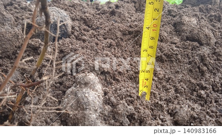 tape measure on the land tape measure on the land 140983166