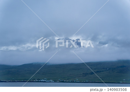 Snowy Mountains and Clouds over Hofn, Iceland 140983508