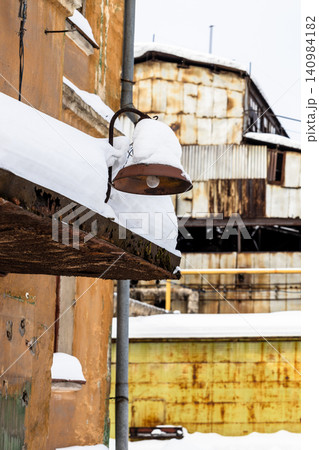 snow-covered front door canopy and street lamp snow-covered front door canopy and street lamp 140984182
