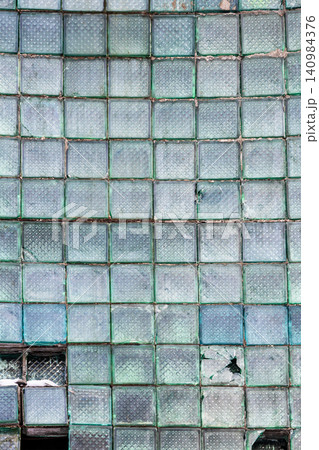 broken Glass block wall on old factory 140984376
