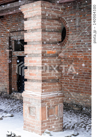 brick column of old building during snowfall brick column of old building during snowfall 140984380
