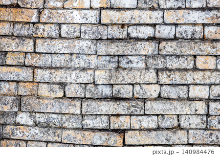 wall of sagging rows of bricks on old factory wall of sagging rows of bricks on old factory 140984476