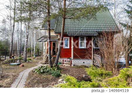 house covered with wood siding and roofing tiles house covered with wood siding and roofing tiles 140984519