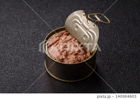 Fish, canned tuna chunks in brine for sandwiches and salads. Canned tuna Fish, canned tuna chunks in brine for sandwiches and salads. Canned tuna 140984603