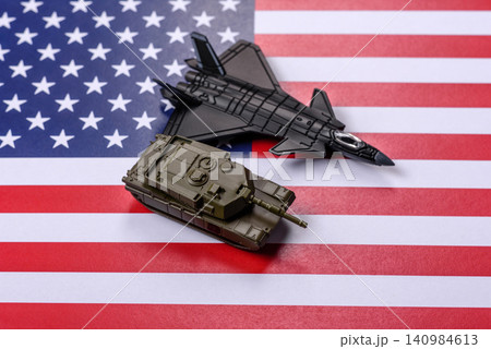 A fighter jet against the US flag as a conceptual background representing defense 140984613