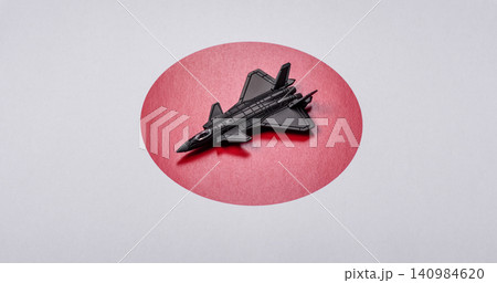 A fighter jet against the Japanese flag as a conceptual background representing defense A fighter jet against the Japanese flag as a conceptual background representing defense 140984620