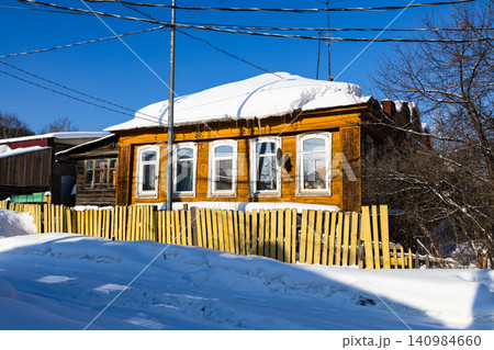 residential wooden houses on snow-covered street residential wooden houses on snow-covered street 140984660