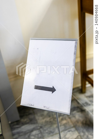 direction arrow on blank sheet of paper billboard direction arrow on blank sheet of paper billboard 140984668