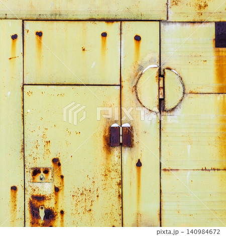 rusty yellow green painted metal shed doors rusty yellow green painted metal shed doors 140984672