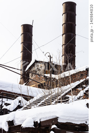 chimneys and steel frames of broken roof of plant chimneys and steel frames of broken roof of plant 140984810