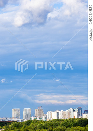 blue cloudy sky over modern residential district 140984929