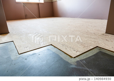 cork flooring tiles glued to concrete base in home cork flooring tiles glued to concrete base in home 140984930