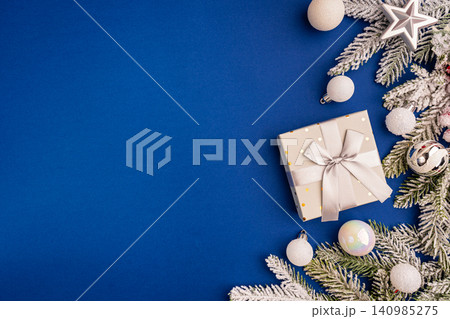 Christmas Border with White Ornaments and Frosted Pine Branches Christmas Border with White Ornaments and Frosted Pine Branches 140985275