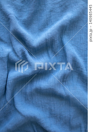 Soft blue linen fabric texture with gentle wrinkles and natural folds for background use Soft blue linen fabric texture with gentle wrinkles and natural folds for background use 140985445