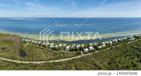American waterfront houses in rural US suburbs. View from above of large residential homes in island small town Boca Grande on Gasparilla Island in southwest Florida 140985606