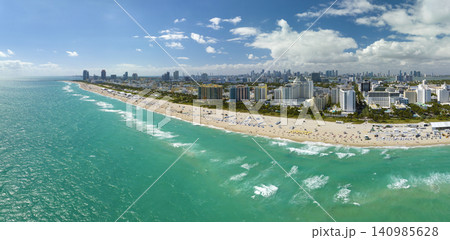 Popular vacation spot in the United States. Ocean warm waters and sandy beachfront at Miami Beach in Florida, USA. American travel destination Popular vacation spot in the United States. Ocean warm waters and sandy beachfront at Miami Beach in Florida, USA. American travel destination 140985628