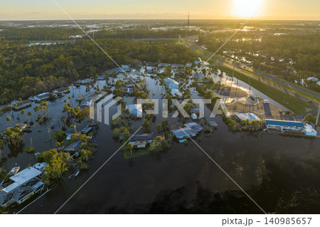 Heavy flood with high water surrounding residential houses after hurricane Ian rainfall in Florida residential area. Consequences of natural disaster 140985657