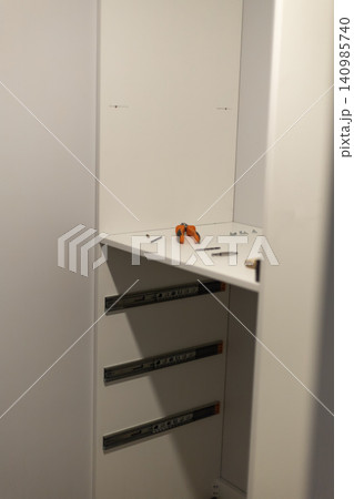 White server rack with hardware components and small tools White server rack with hardware components and small tools 140985740