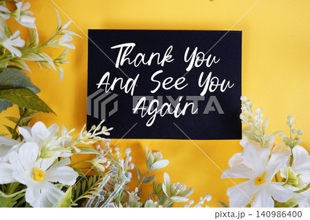Thank You And See You Again text written on paper card with flowers decoration on blue background Thank You And See You Again text written on paper card with flowers decoration on blue background 140986400