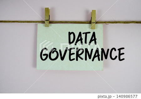 Data Governance paper notes hanging on the rope with clothespins Data Governance paper notes hanging on the rope with clothespins 140986577