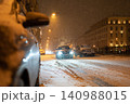 Transport collapse during winter snowfall at night, snow blizzard causes huge traffic jam on road 140988015