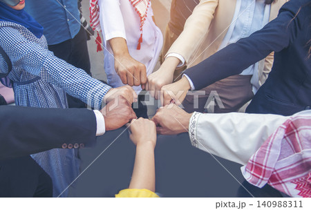 Diverse multiethnic Partners hands together teamwork group of multiracial people meeting join hands togetherness. Diversity people hands join empower partnership teams connection volunteer community Diverse multiethnic Partners hands together teamwork group of multiracial people meeting join hands togetherness. Diversity people hands join empower partnership teams connection volunteer community 140988311