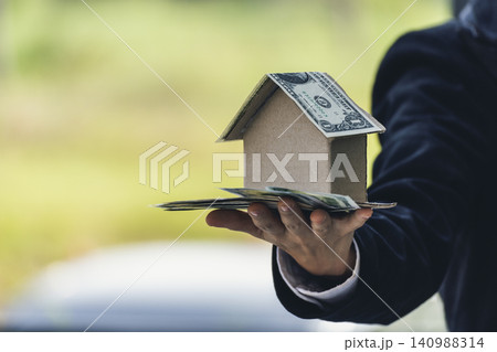 Real estate agent hands holding home business mortgage loan investment property. Hands saving protection home residential concepts. Insurance Agent sale residence ownership household protection care 140988314