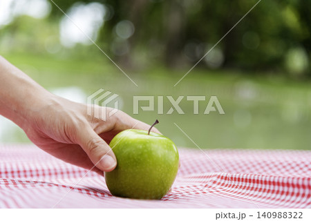 young asian woman eating Apple Healthy. Girl workout holding organic apple fruit healthy lifestyle. Wellness Asian women eat red apple smile face look at camera. Beauty health care lifestyle concept young asian woman eating Apple Healthy. Girl workout holding organic apple fruit healthy lifestyle. Wellness Asian women eat red apple smile face look at camera. Beauty health care lifestyle concept 140988322
