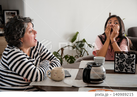 Mother and Daughter Having Fun Surprise Conversation Mother and Daughter Having Fun Surprise Conversation 140989215