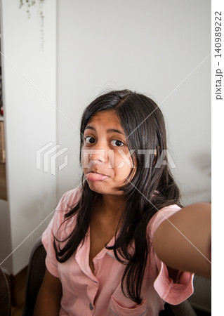 Teenager Taking a Selfie at the Table Teenager Taking a Selfie at the Table 140989222